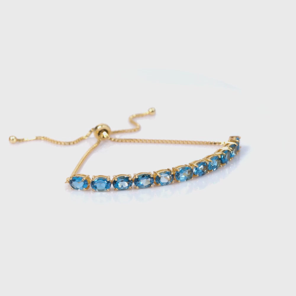 Load video: 925 Sterling Silver 18K Gold London Blue Topaz Classic Oval Adjustable Bracelet