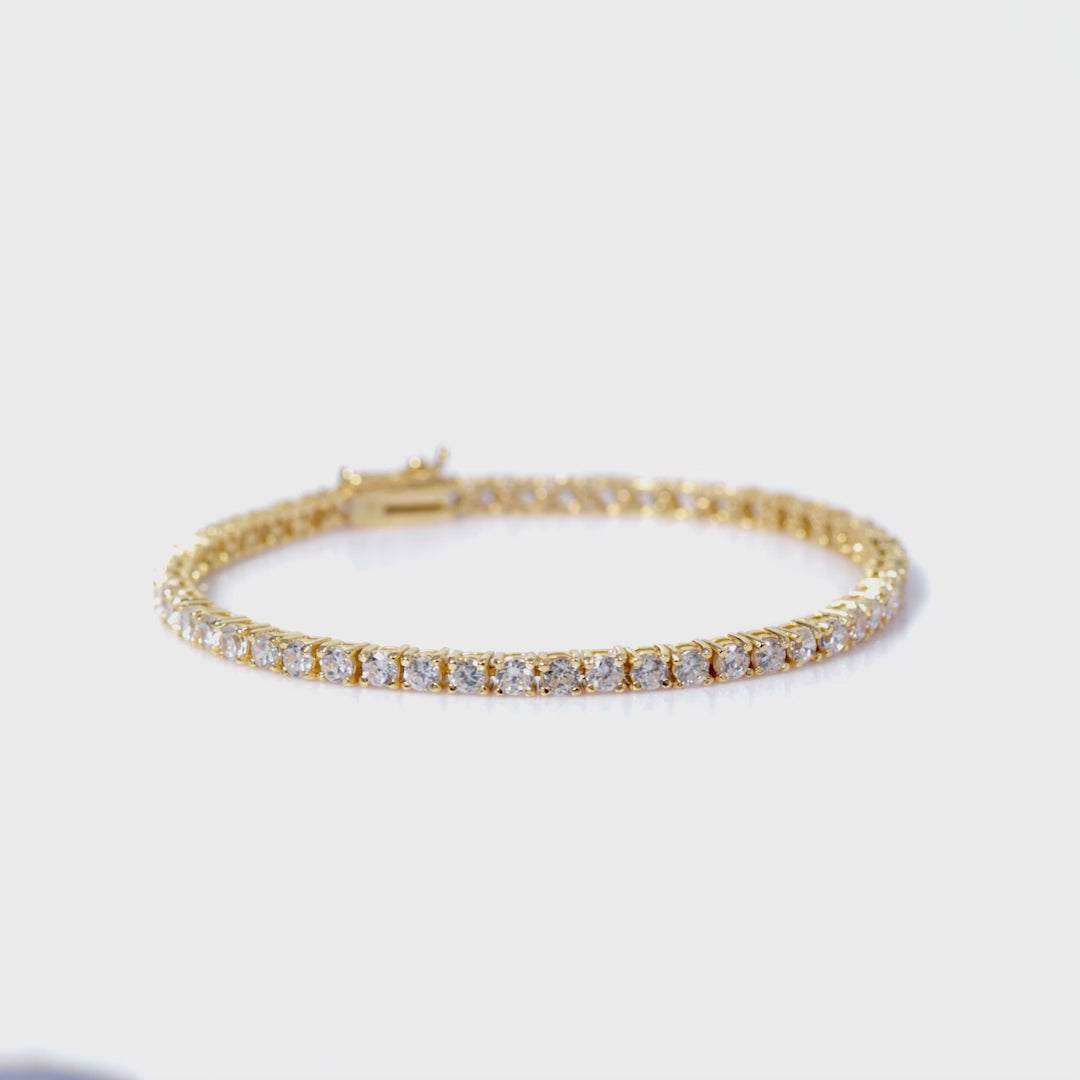 Load video: 925 Sterling Silver 18K Gold Plated White CZ Mini Tennis Bracelet 7.25 Inches