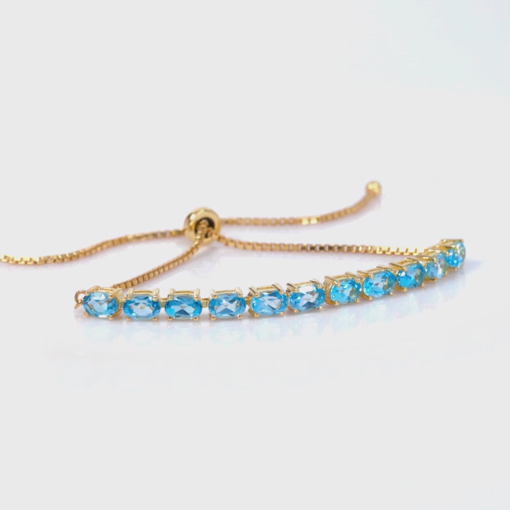 Load video: 925 Sterling Silver 18K Gold Plated Sky Blue Topaz Oval Adjustable Bracelet