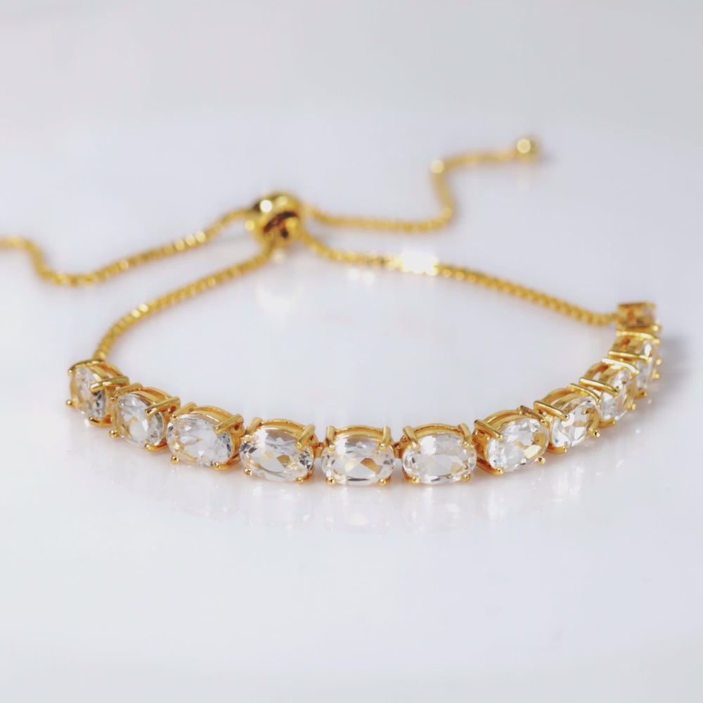 Load video: 925 Sterling Silver 18K Gold Plated White Topaz Oval Adjustable Bracelet
